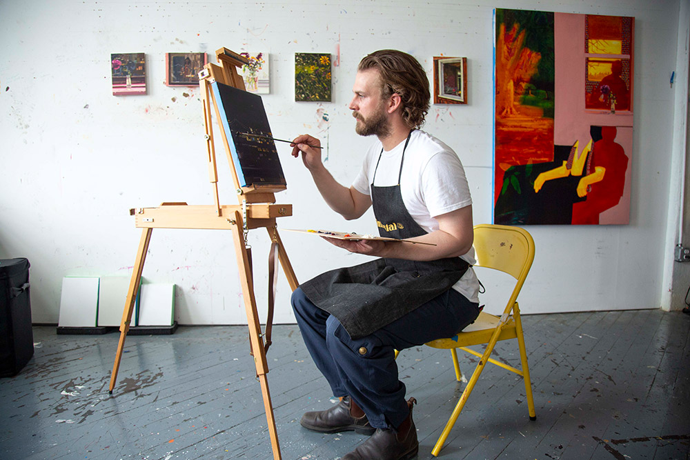 Keiran Brennan Hinton painting in his studio