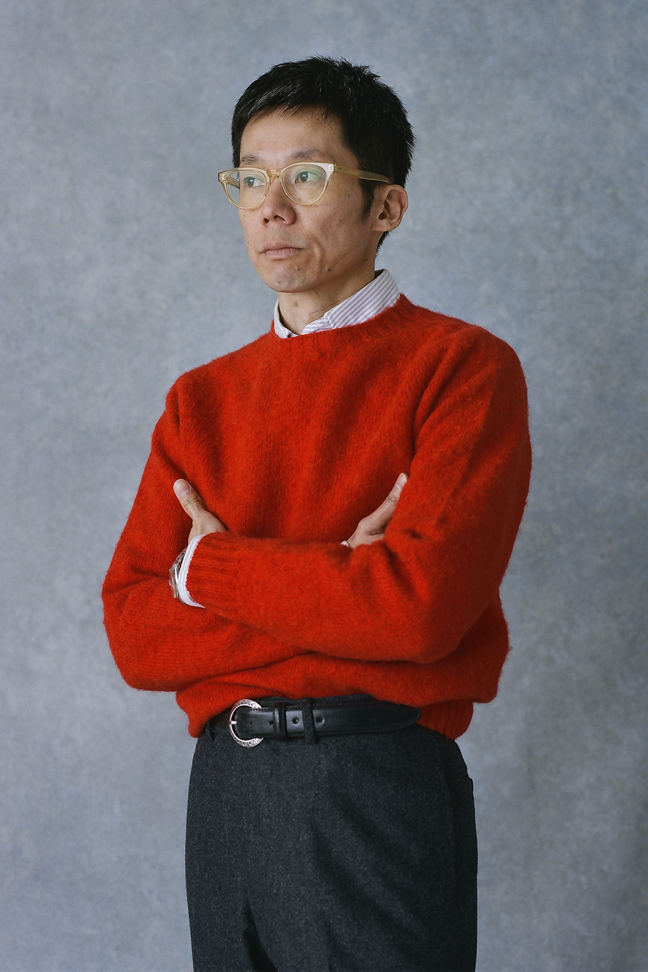 Man in red sweater with arms crossed
