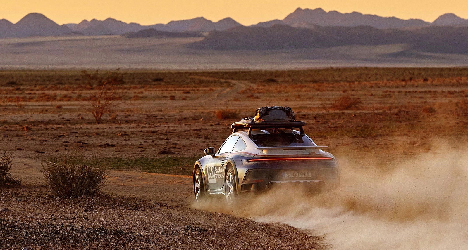 Porsche 911 Dakar Feature image driving desert