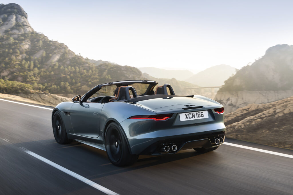 Jaguar F-Type driving along the road from the backside