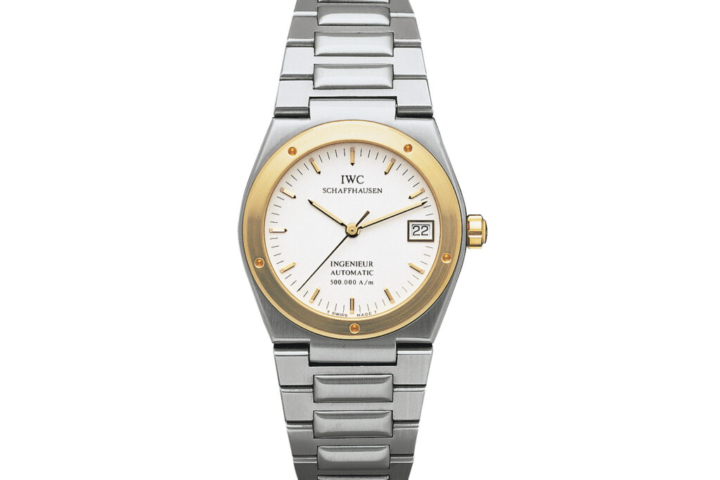 Ingenieur Automatic 40 with gold rim around a white dial on white background from front