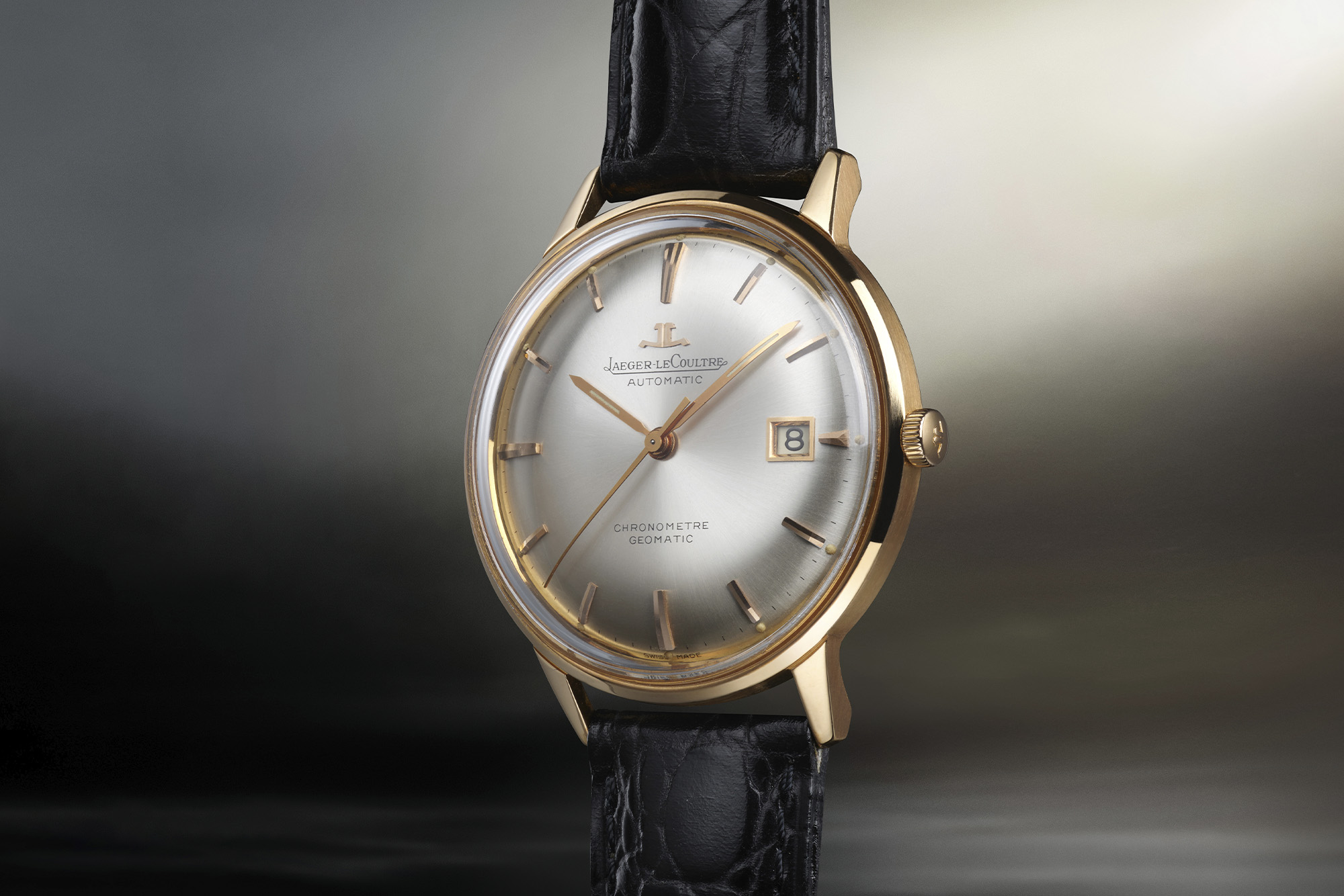 Jaeger-LeCoultre watch with gold rim and white dial