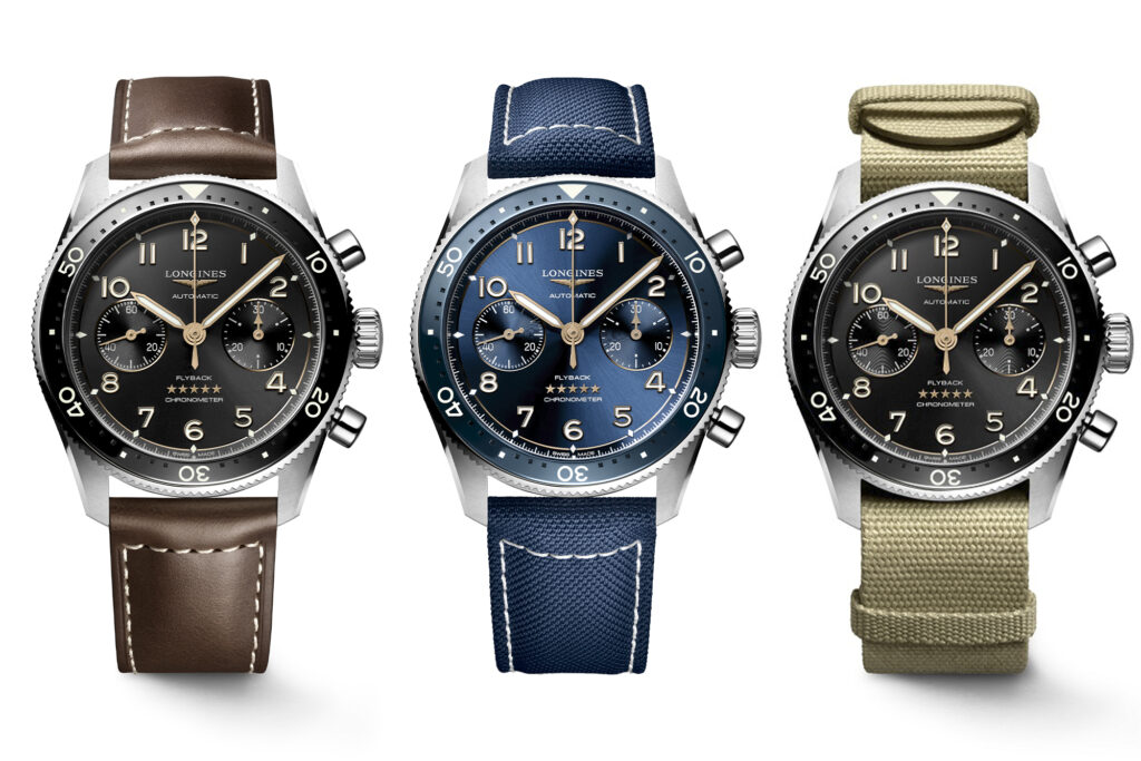 Longines Flyback watches in lineup: blue dial and blue strap in centre, black dial and brown strap on left, canvas strap and black dial on right