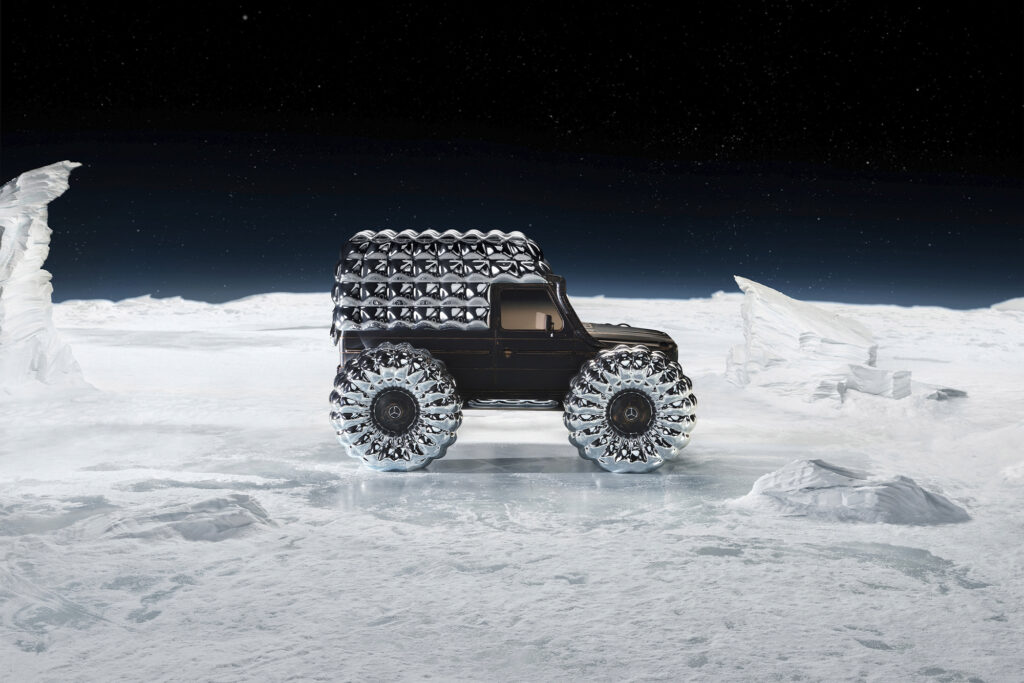 Mercedes Moncler featured car in distance on snow and black sky background