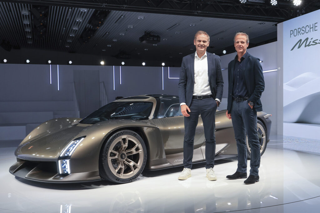 Porsche Mission X front side view with Porsche executives