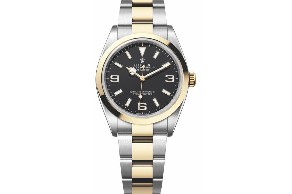 Rolex Oyster Perpetual Explorer watch in gold and silver with black dial