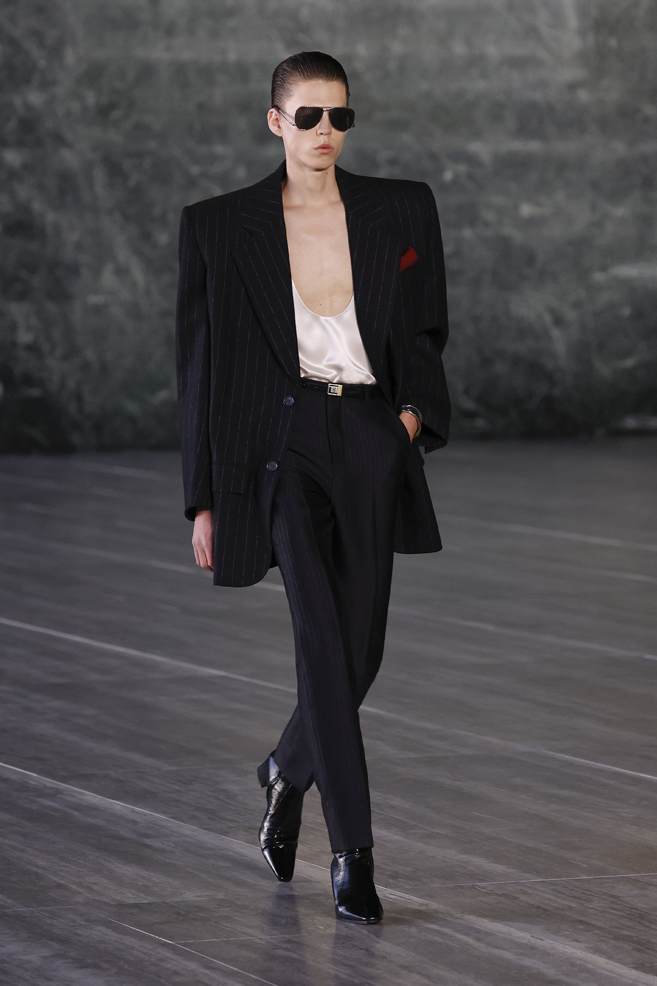 Saint Laurent Spring/Summer 2024 male model in suit with tank top on runway