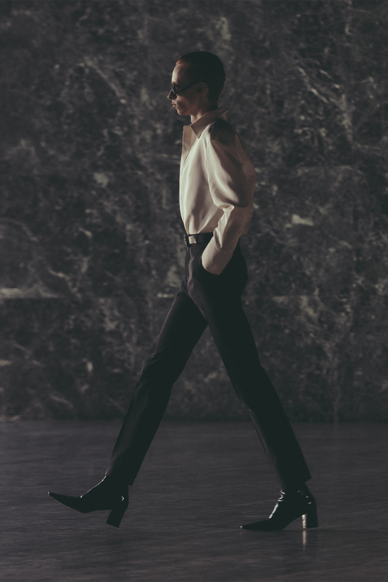 Saint Laurent Spring/Summer 2024 menswear model in white shirt and black pants walking on the runway