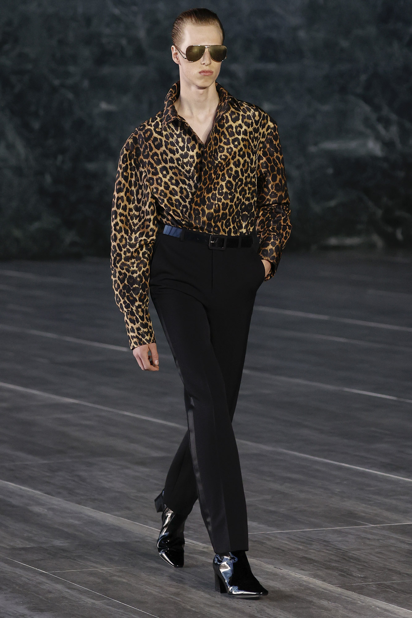 Saint Laurent Spring/Summer 2024 male model in leopard print shirt and sunglasses on runway