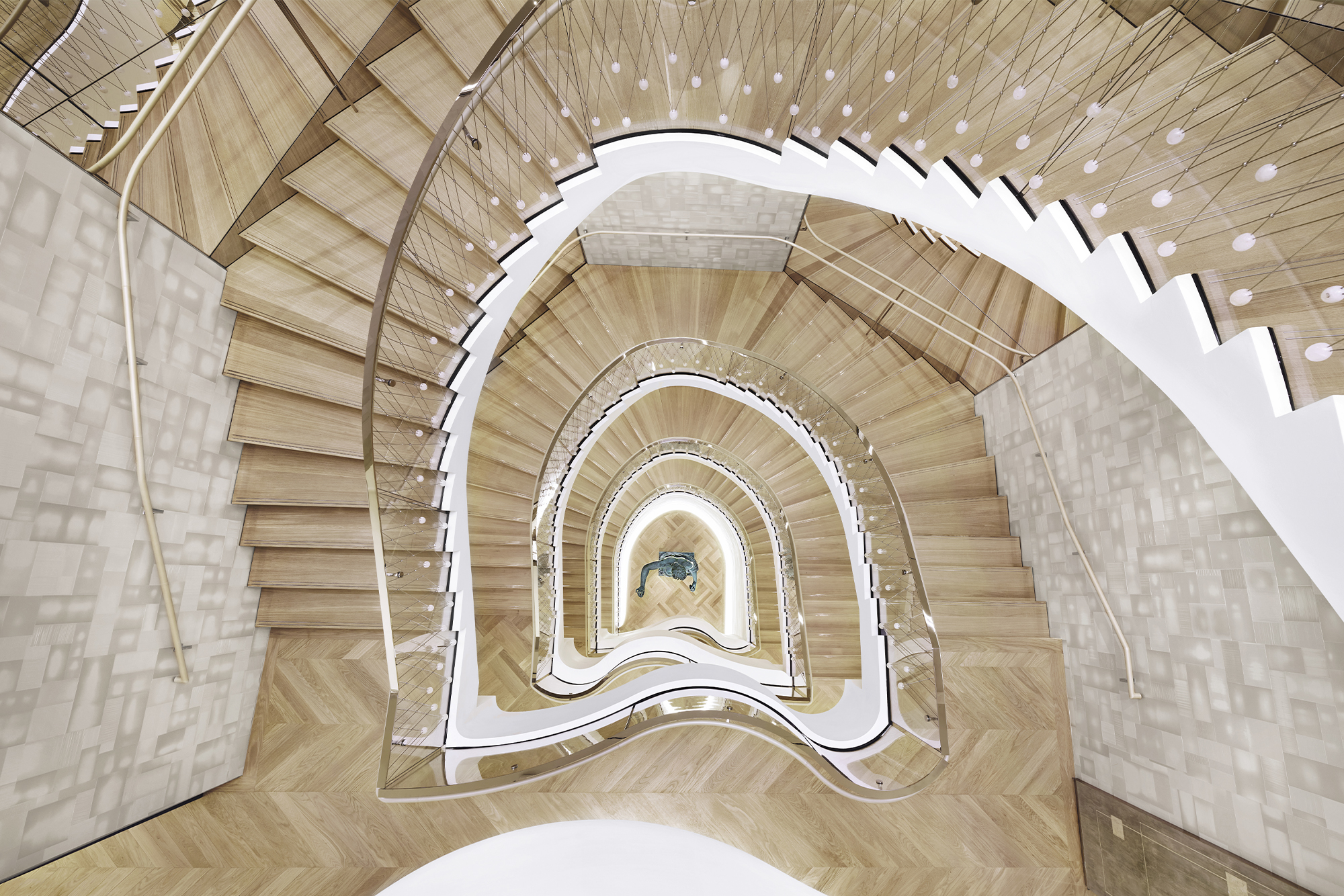 Tiffany & Co. The Landmark interior bird's eye view of gold staircase