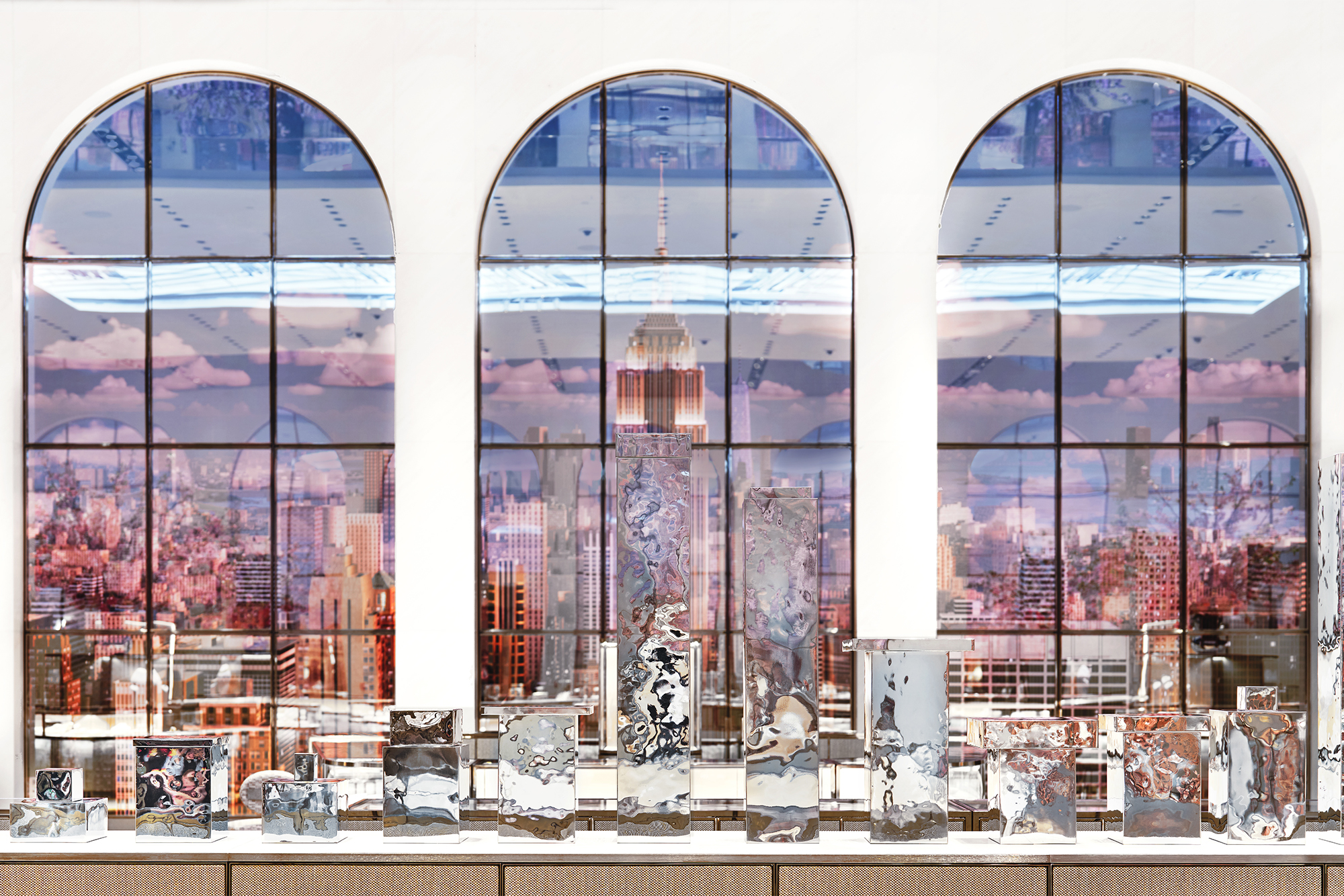 Tiffany & Co. The Landmark interior with arched windows with pink background and table