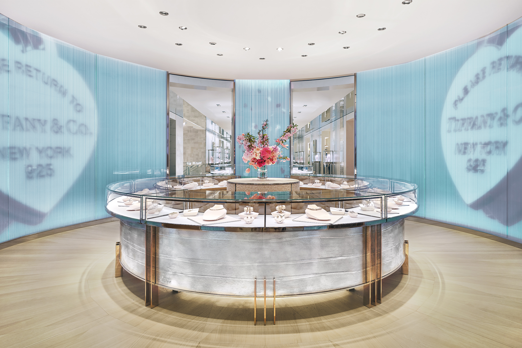 Tiffany & Co. The Landmark interior curved with blue wall and circular table