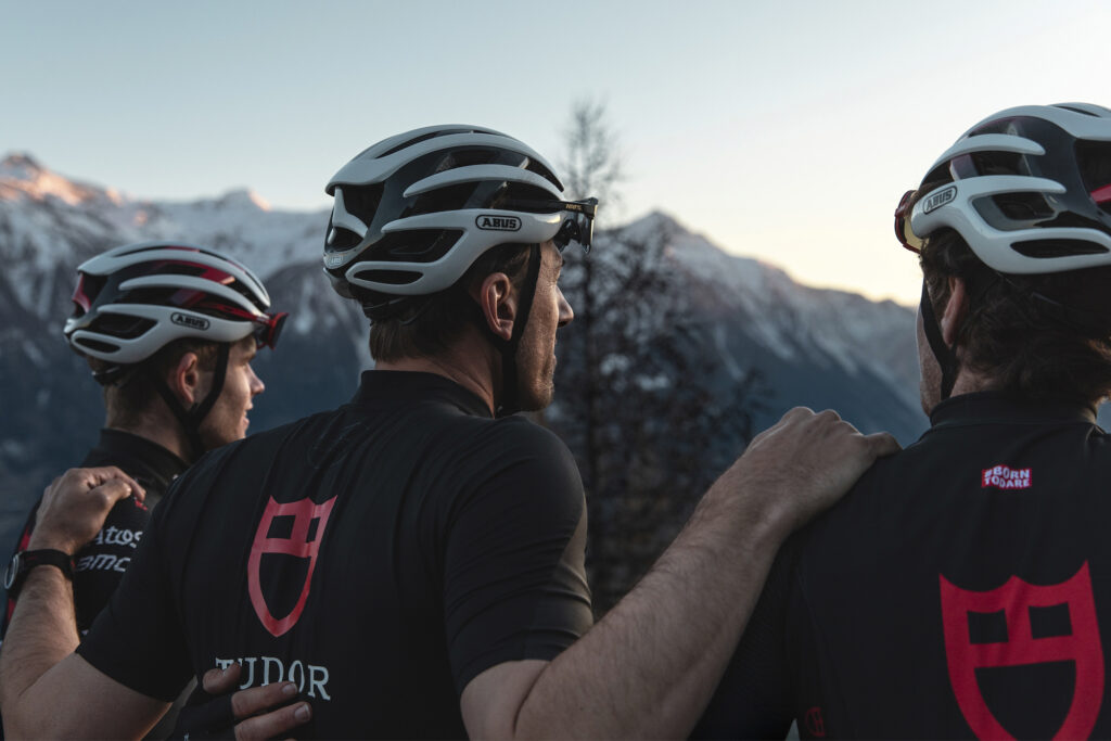 Tudor Pro Cycling team looks out over mountains