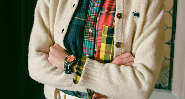 Come Together Watch Collab Feature Photo: arms crossed to show orange dial