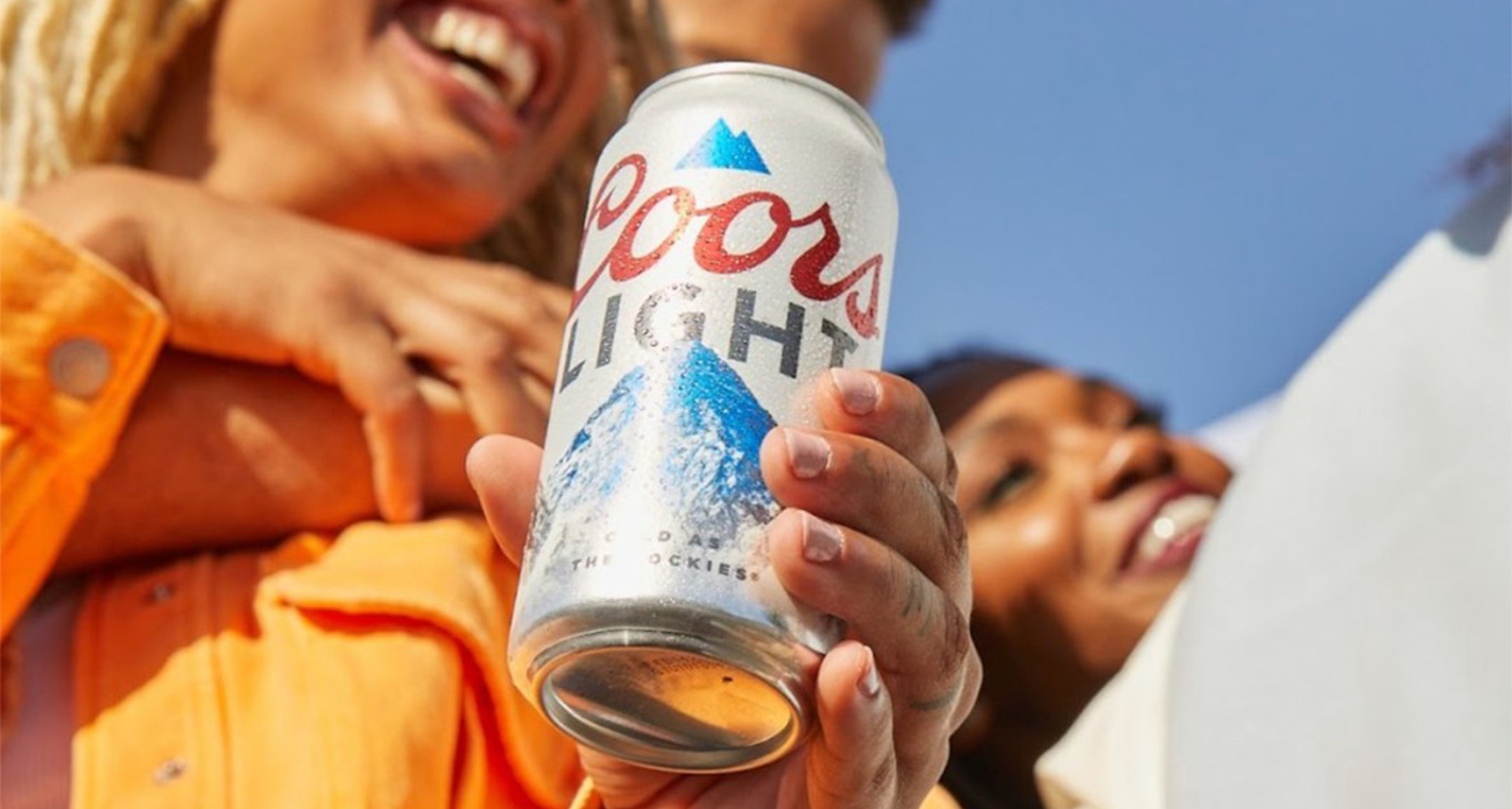 Coors light temporary retirement woman holding can and laughing