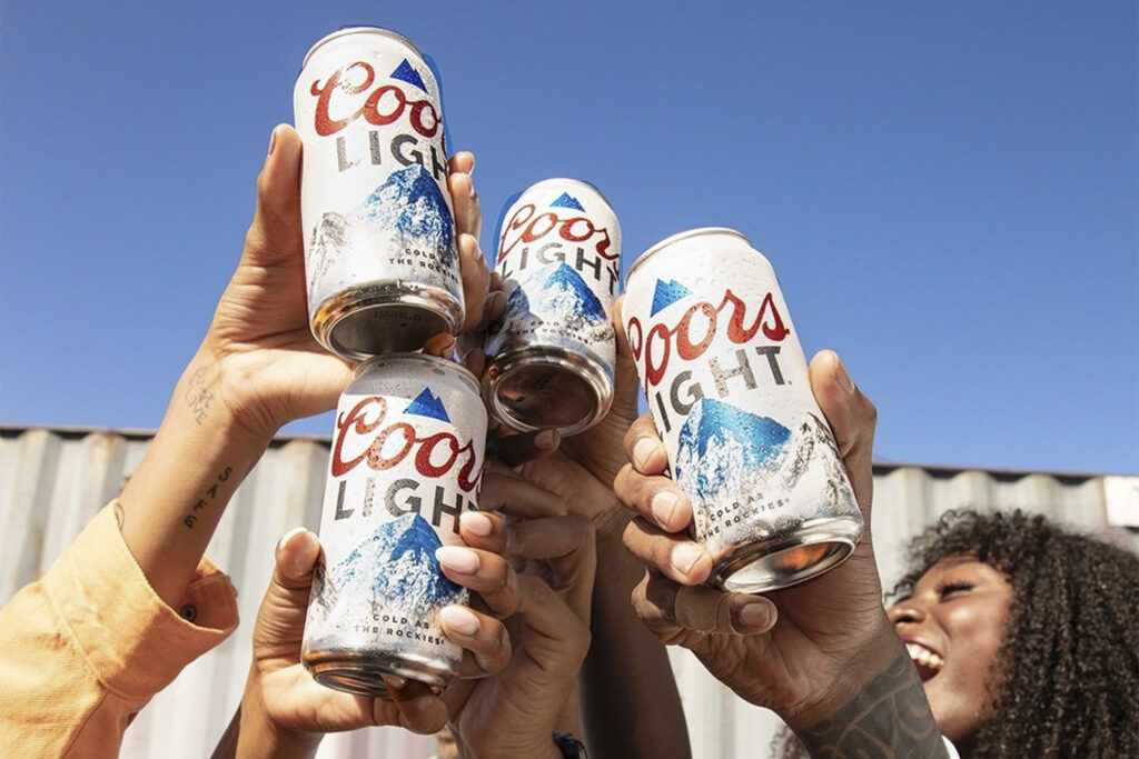 Coors Light Temporary Retirement Cans clinking in air
