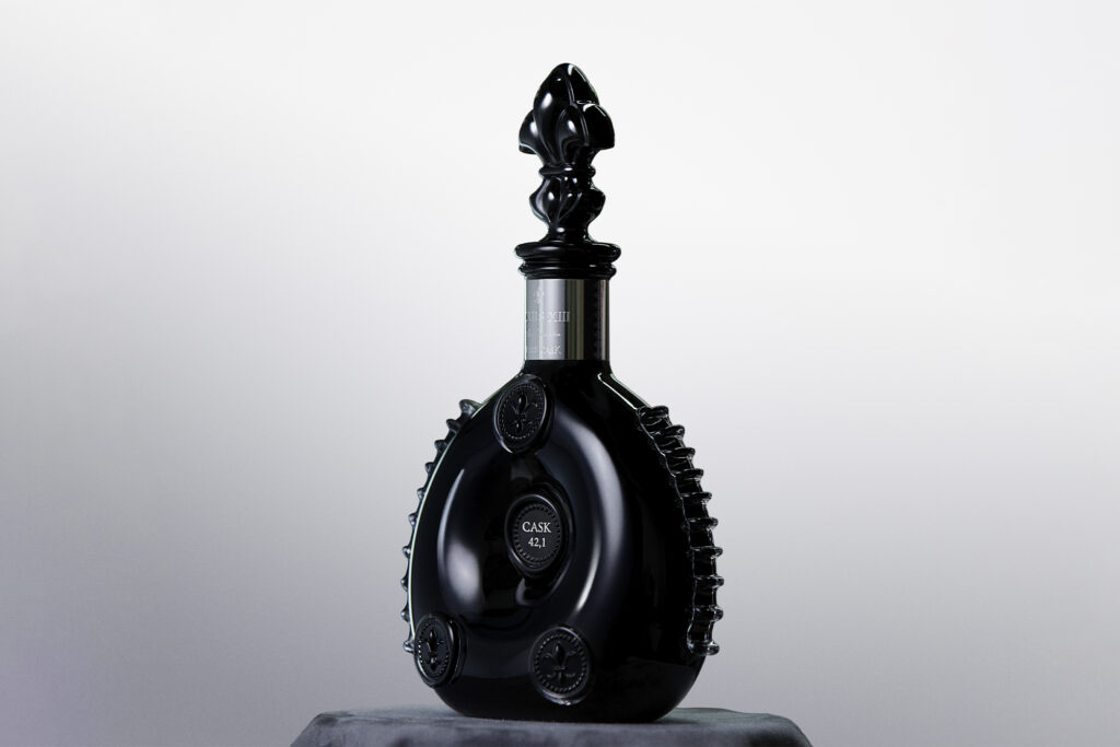 Louis XIII bottle shot against silver chrome background