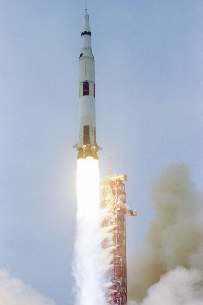 apollo 13 rocket ship taking off on clear day