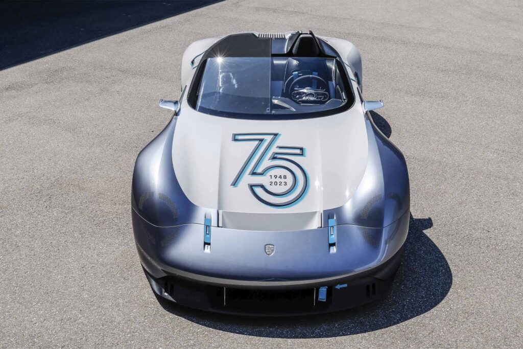 Porsche Vision 357 Speedster front of the blue and white convertible is set from above. 75 is painted on the hood. the top is down