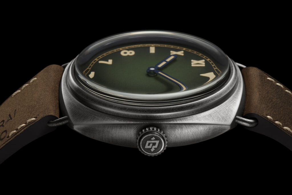 Panerai Radiomir California, green dial watch shot from side with strap laid out on black background