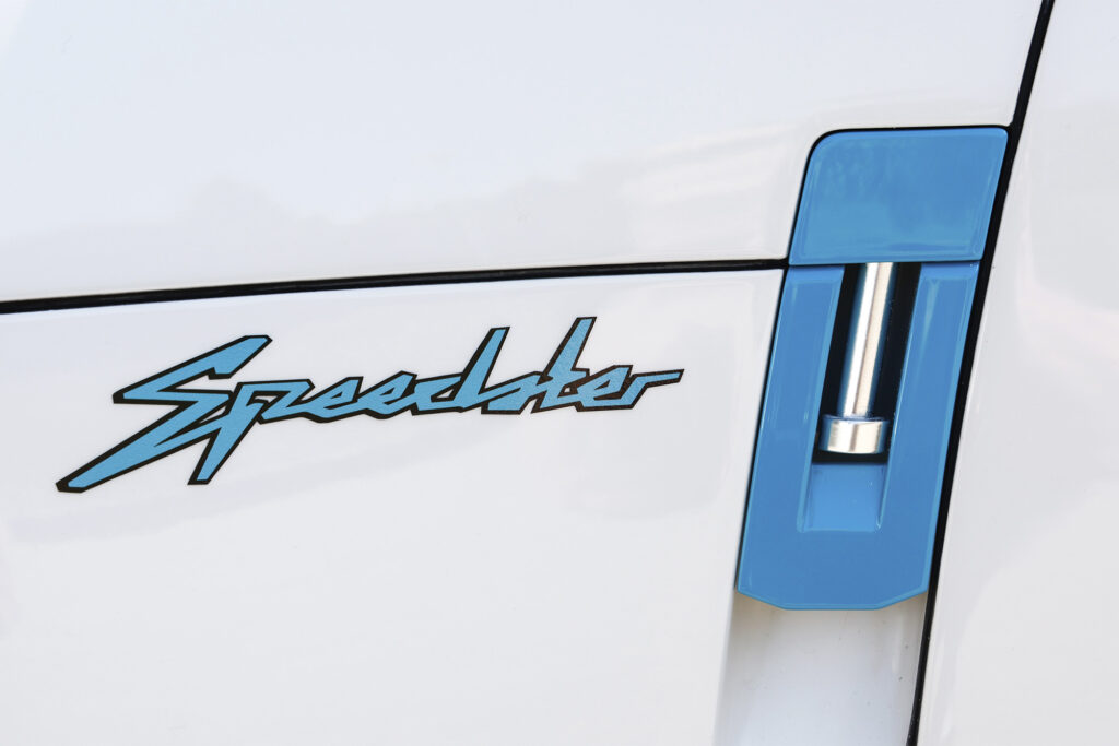 Porsche 357 Speedster detail shot of "speedster" stained in blue on the white exterior