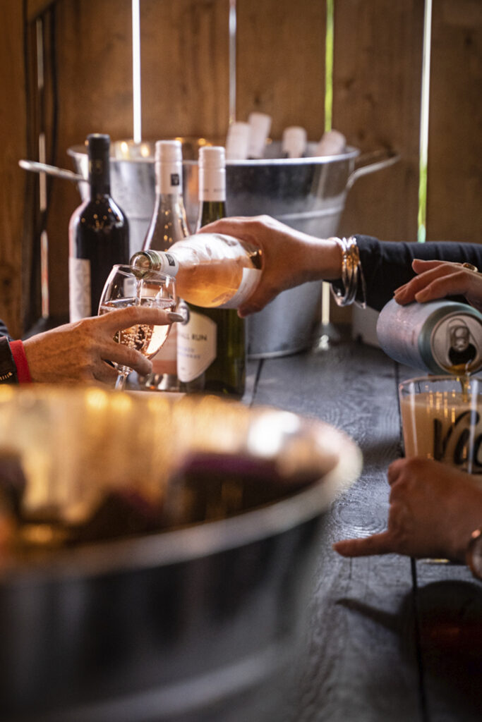 bartender fills guest's wine glass at vic social