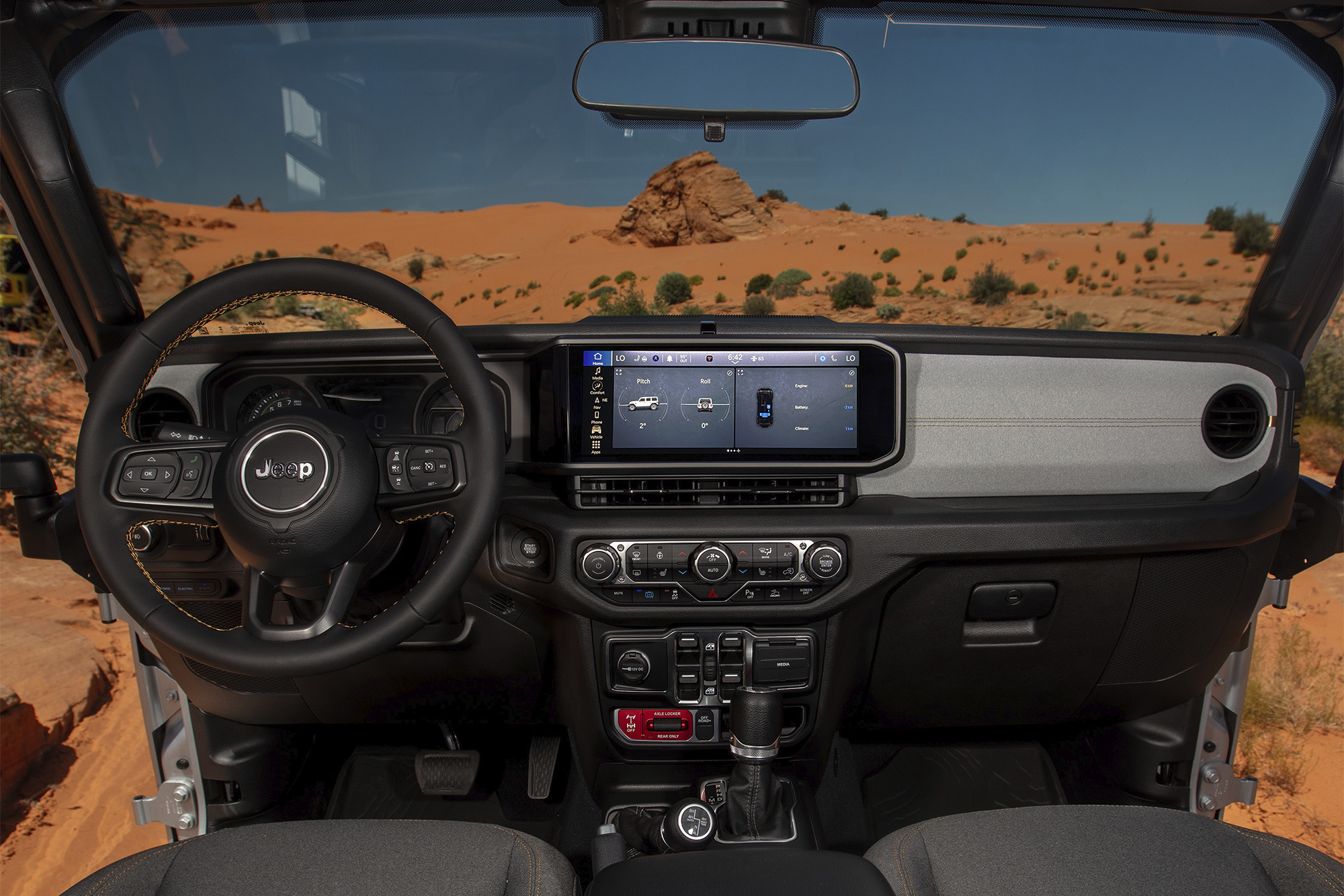 Jeep Wrangler shot of dashboard, window looks out onto desert