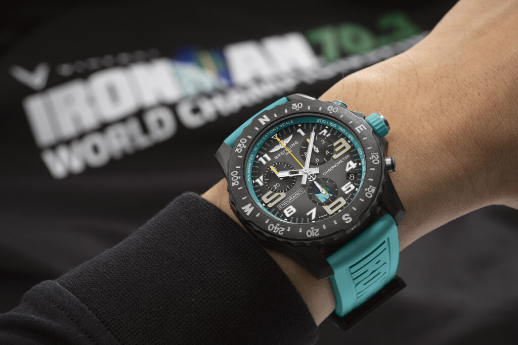 Limited Edition Breitling Endurance Pro for Ironman in turquoise on a left wrist.