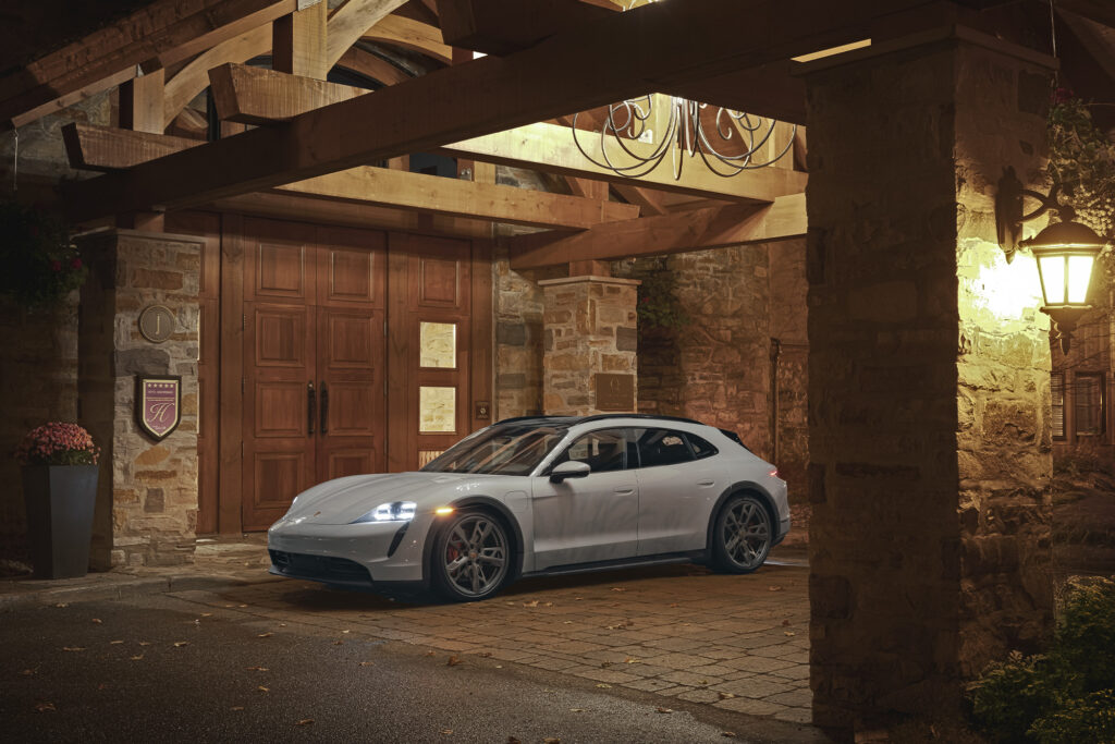 White Porsche charges inside Hotel Quintessence, shot from the side-front angle