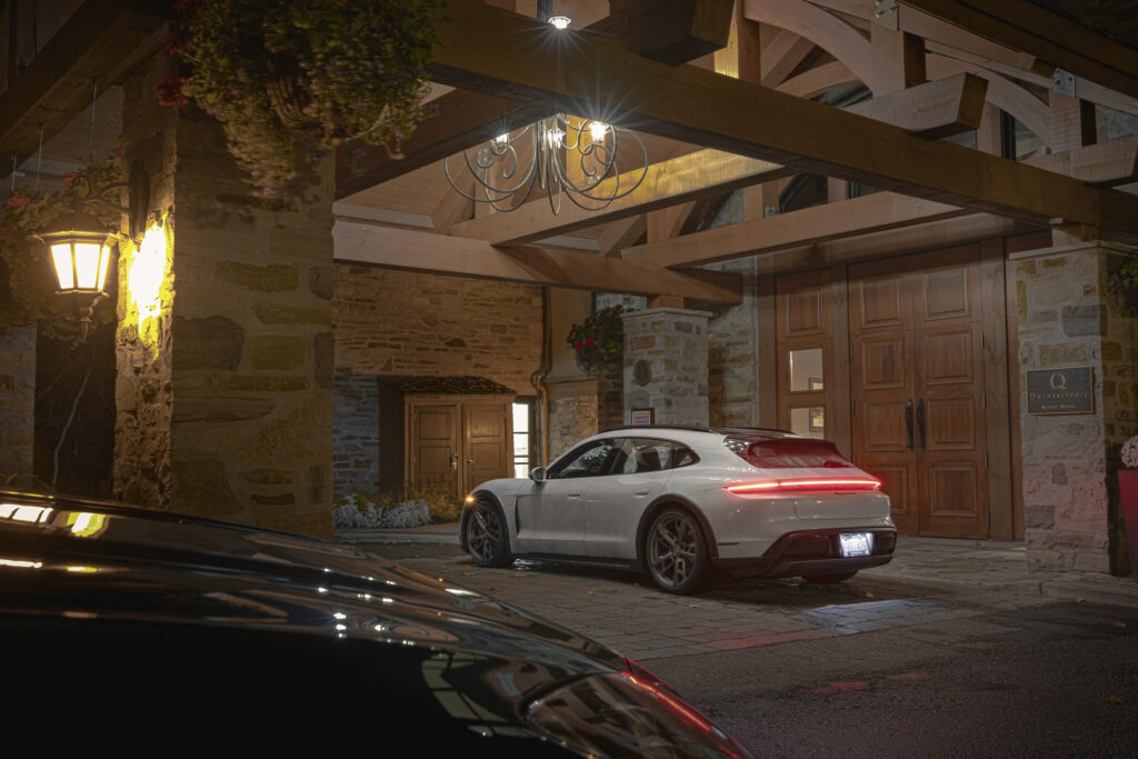 White Porsche charges inside Hotel Quintessence, shot from side-back angle