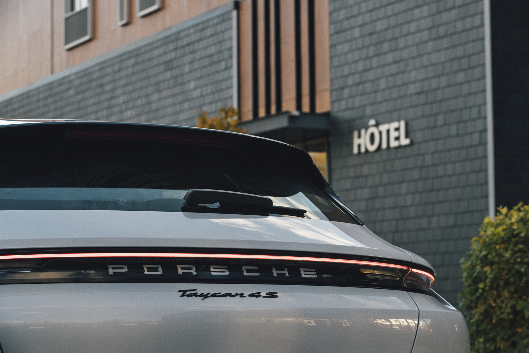 White porsche parked at hotel spa la Germain Charlevoix closeup of back window to show detail