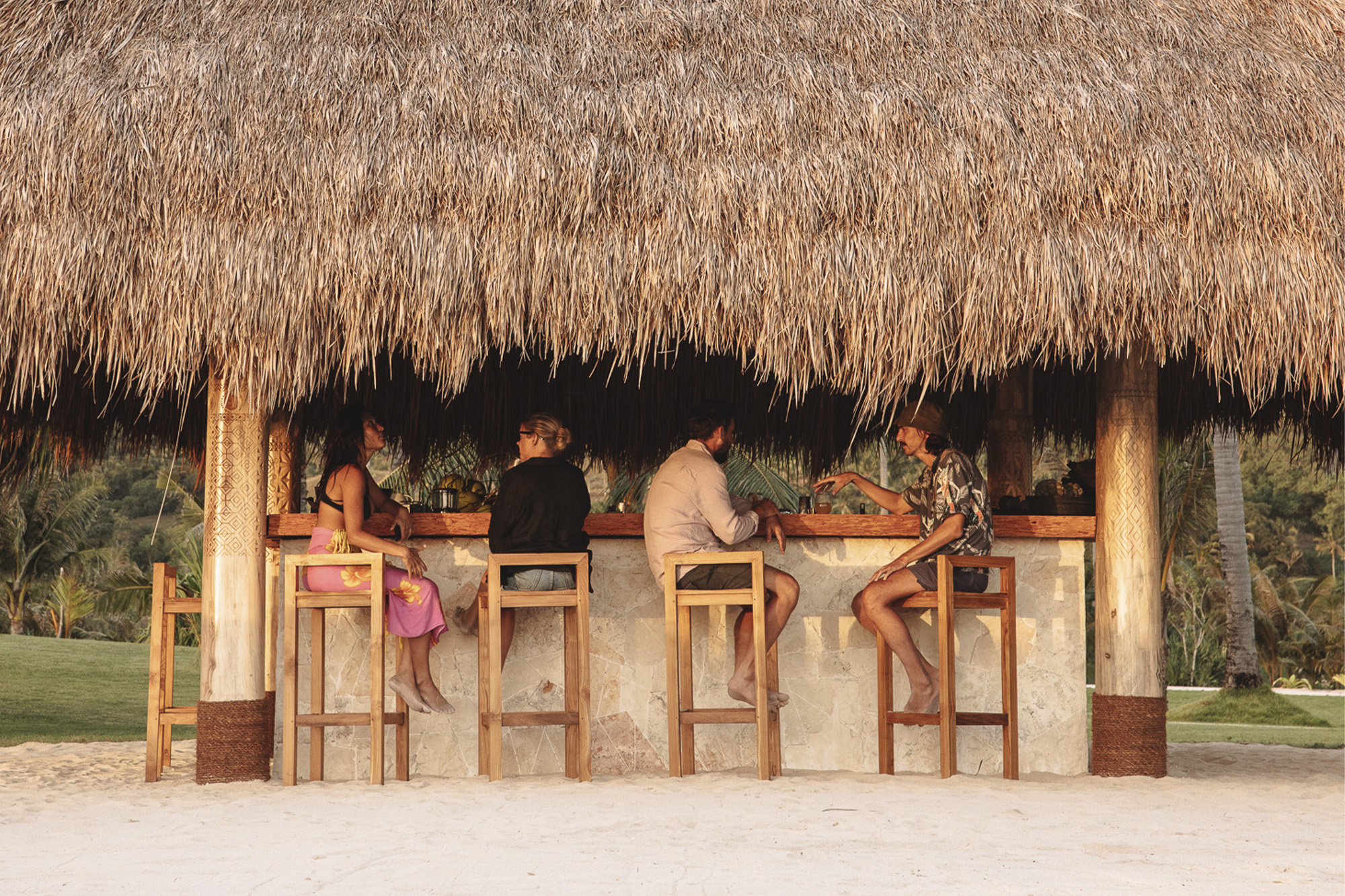 People eating at a beach bar in Sanubari Sunda, Indonesia