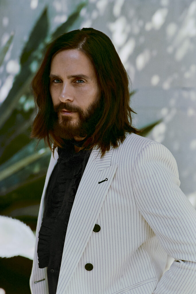 Jared Leto by wall with plant for SHARP September close-up