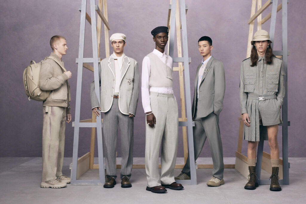 Kim Jones designed Dior for SS24, five models stand by ladders and lavender wall 