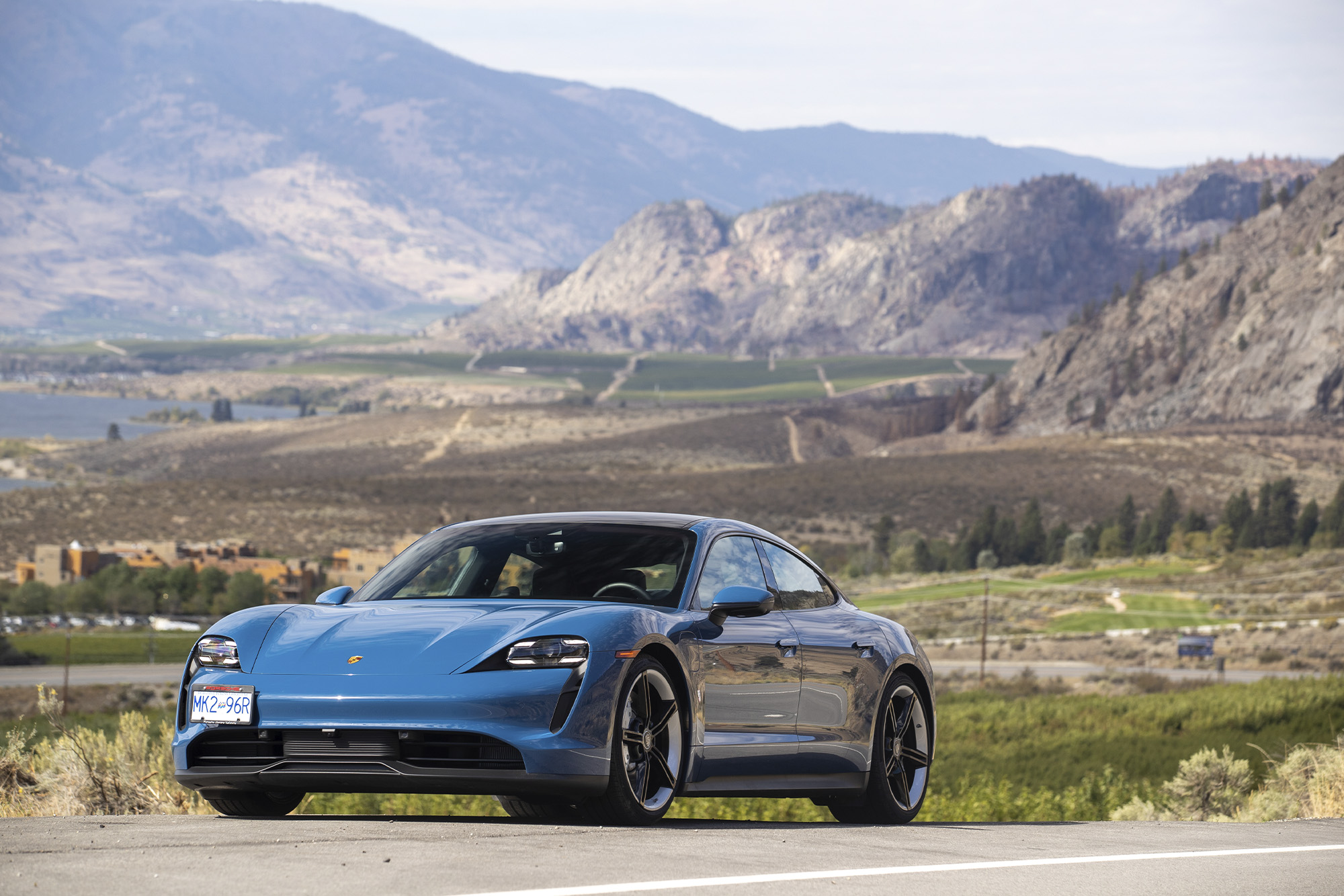 Spirit Ridge Resort: blue Porsche parked in desert, shot from the front-side