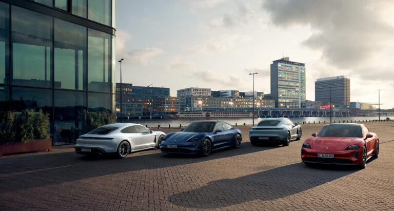 Porsche Taycans parked in a row