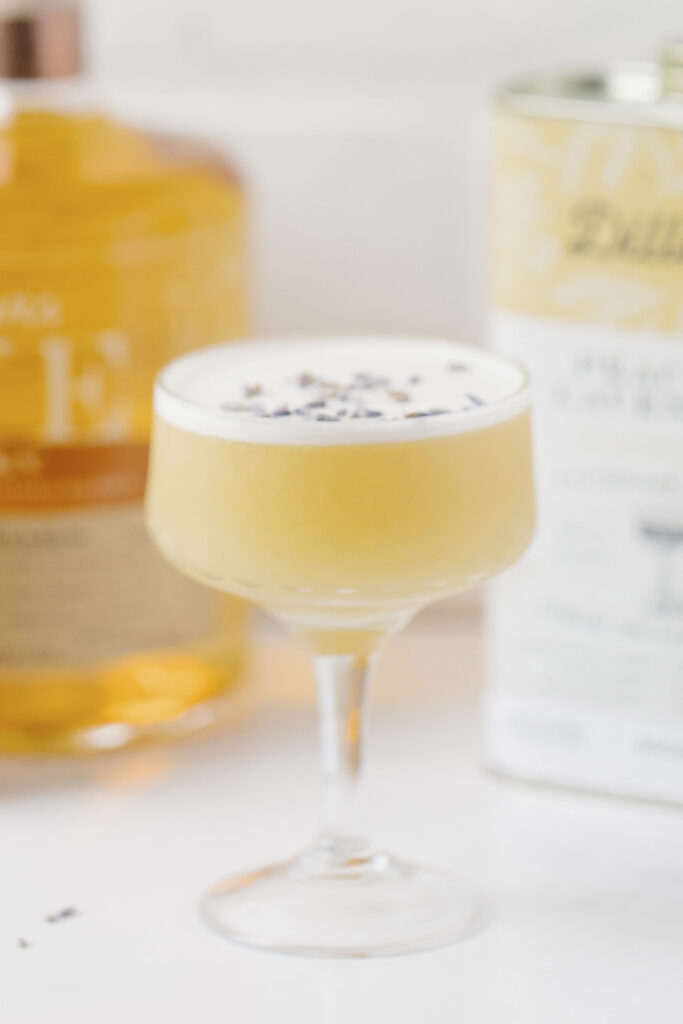 Whisky Sour in glass on white countertop