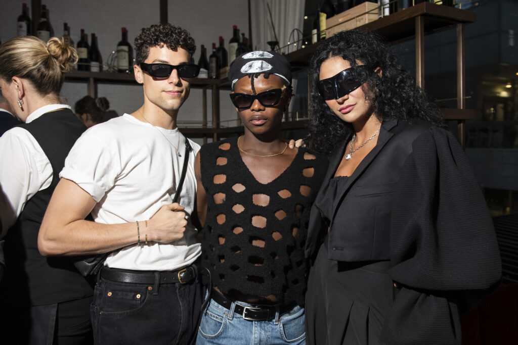 Three people in sunglasses pose for Bad Boy Cobalt launch party at Black+Blue Toronto