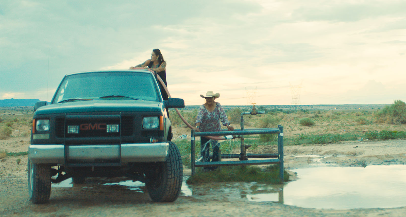 Film still from Boil Alert premiere shows truck parked in a field