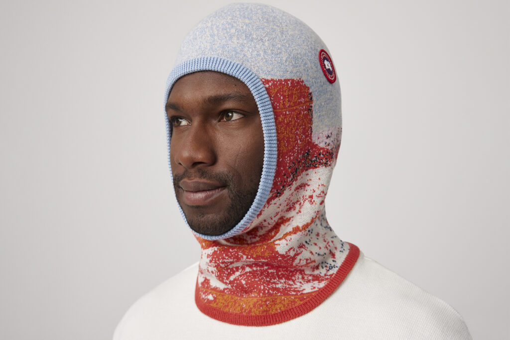 Man modelling over-head knitwear for Canada Goose Rokh collab