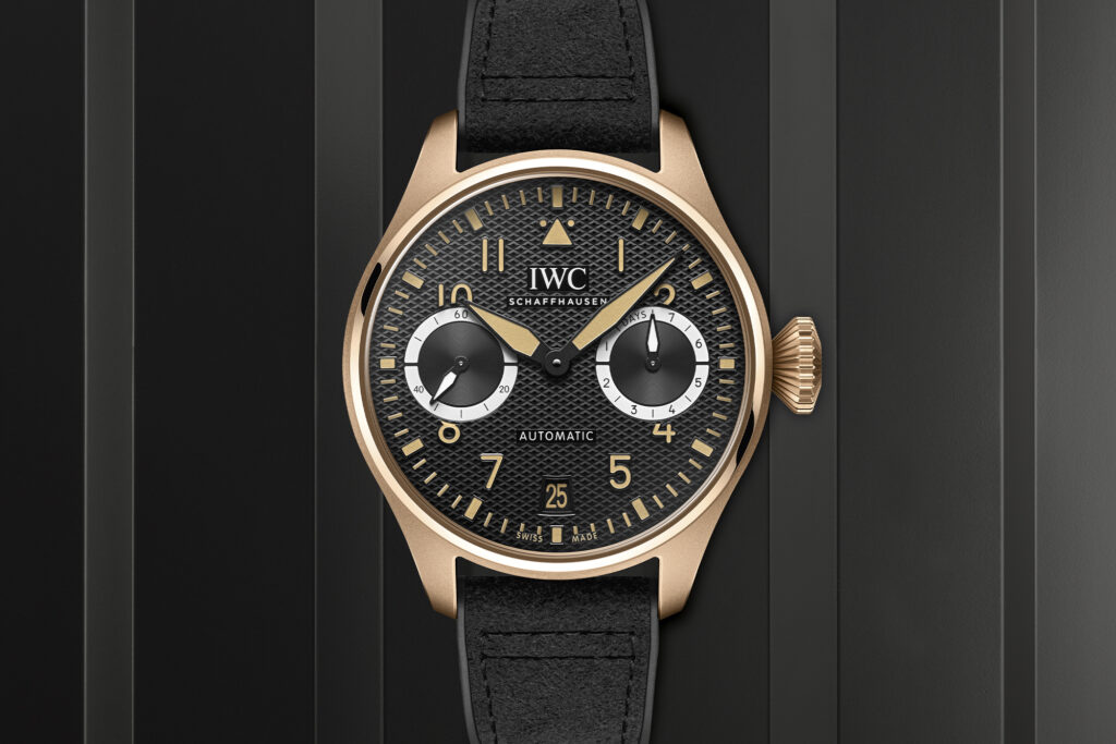 IWC Big Pilot’s Watch AMG G 63 in gold on a black striped background