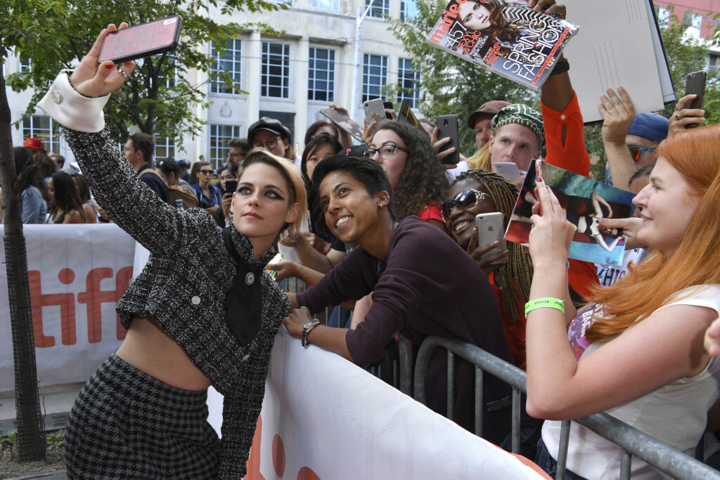 Kristen Stewart poses with fans at TIFF