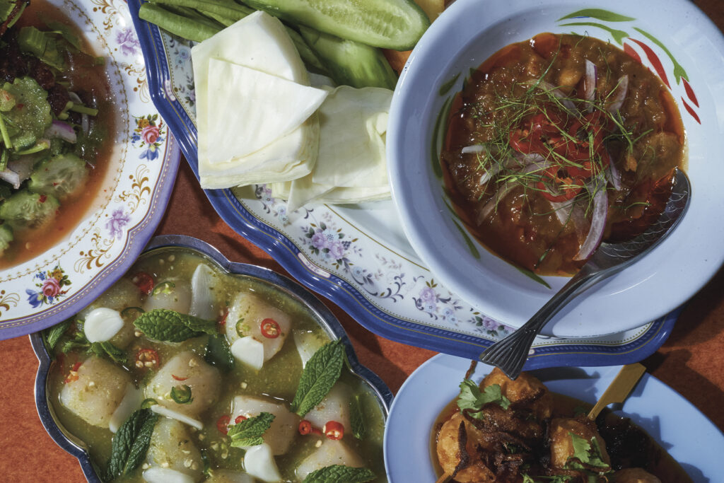 Pichai restauant table full of authentic dishes