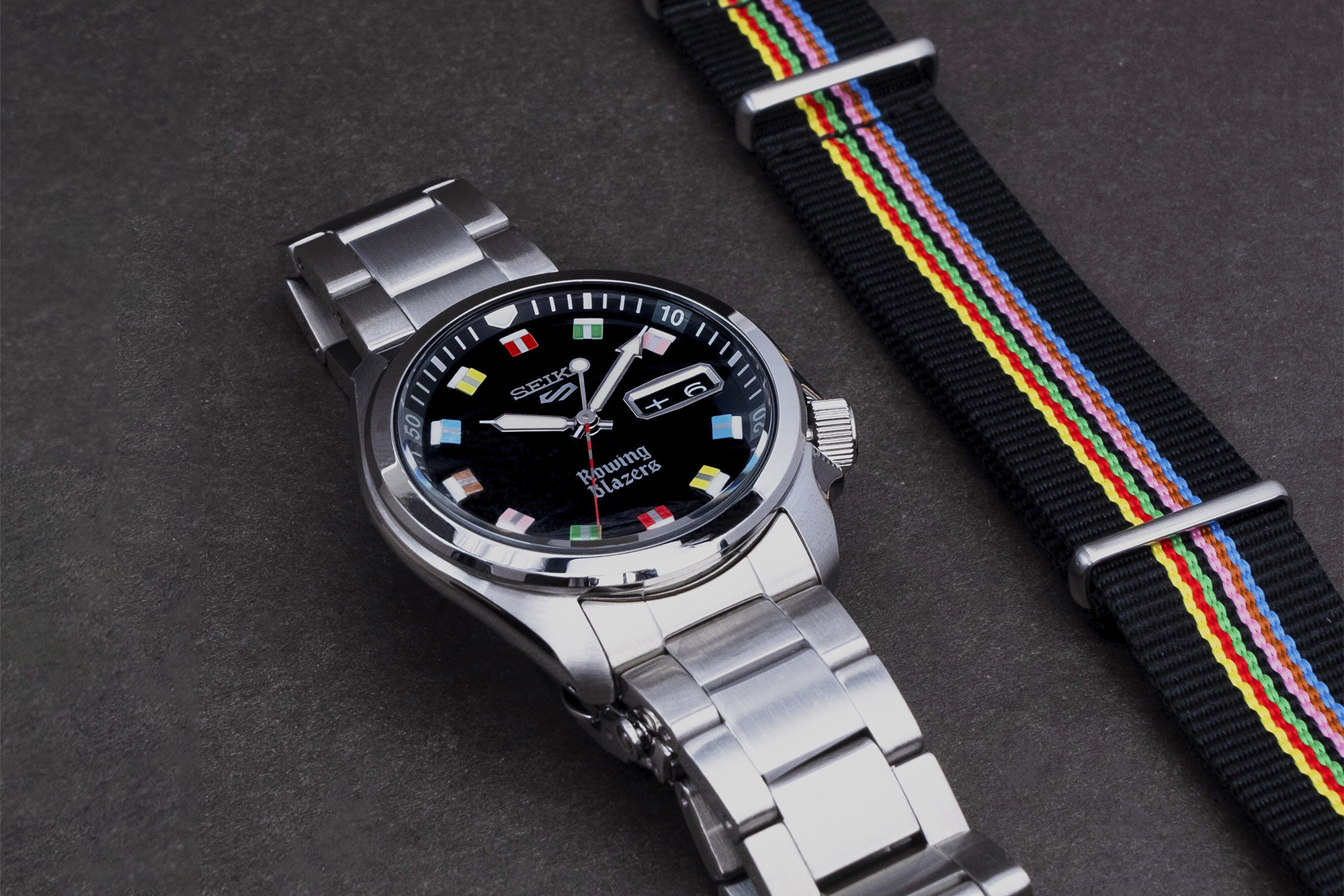 Seiko 5 Rowing Blazer watches laid on on black background