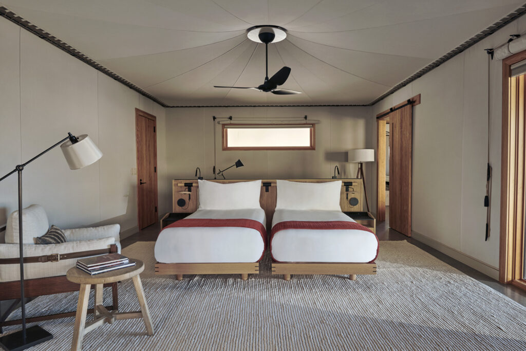 inside of a room at Amangiri Camp Sarika in Utah, twin beds