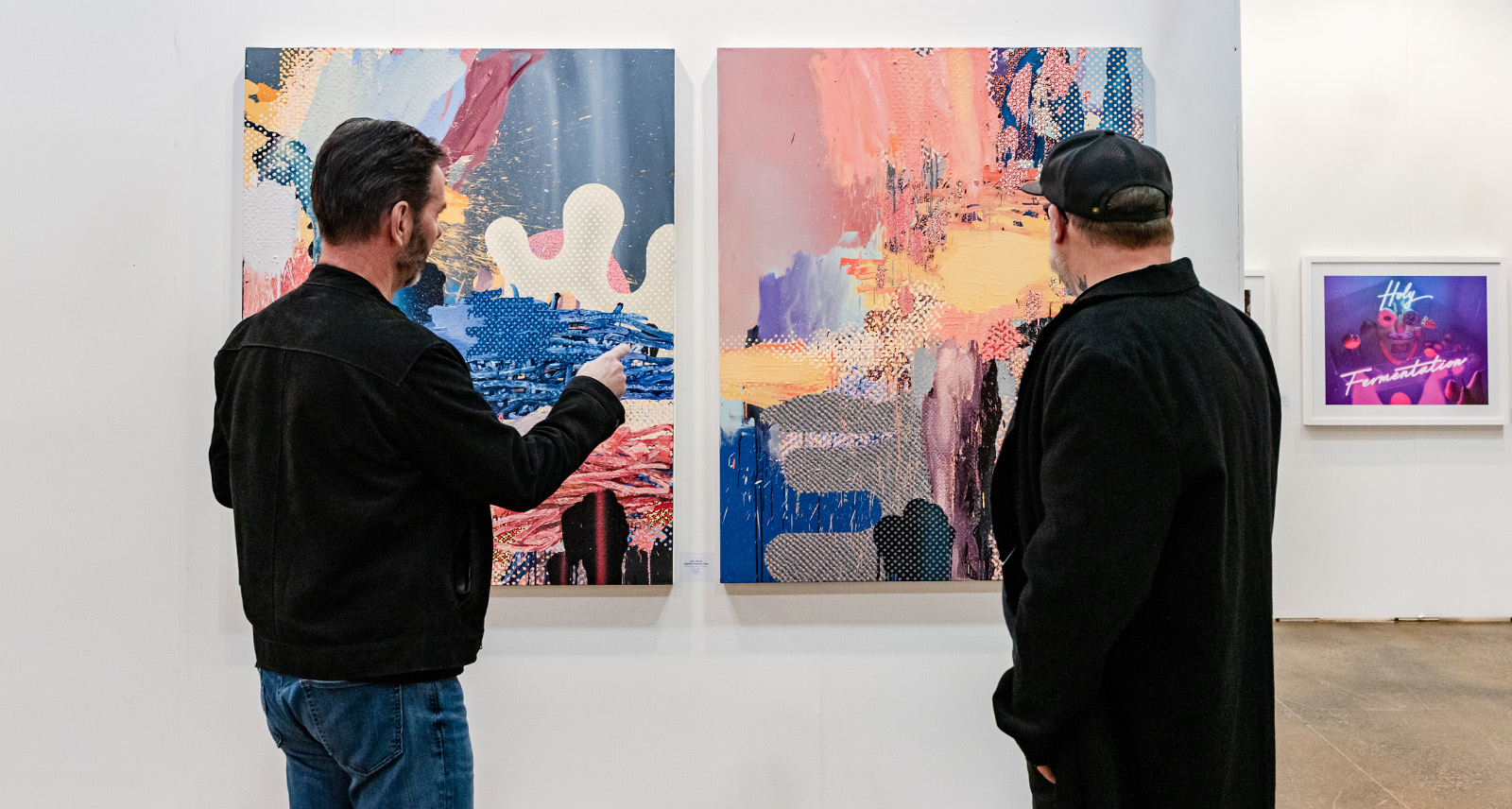 Two onlookers at Art Toronto 2022