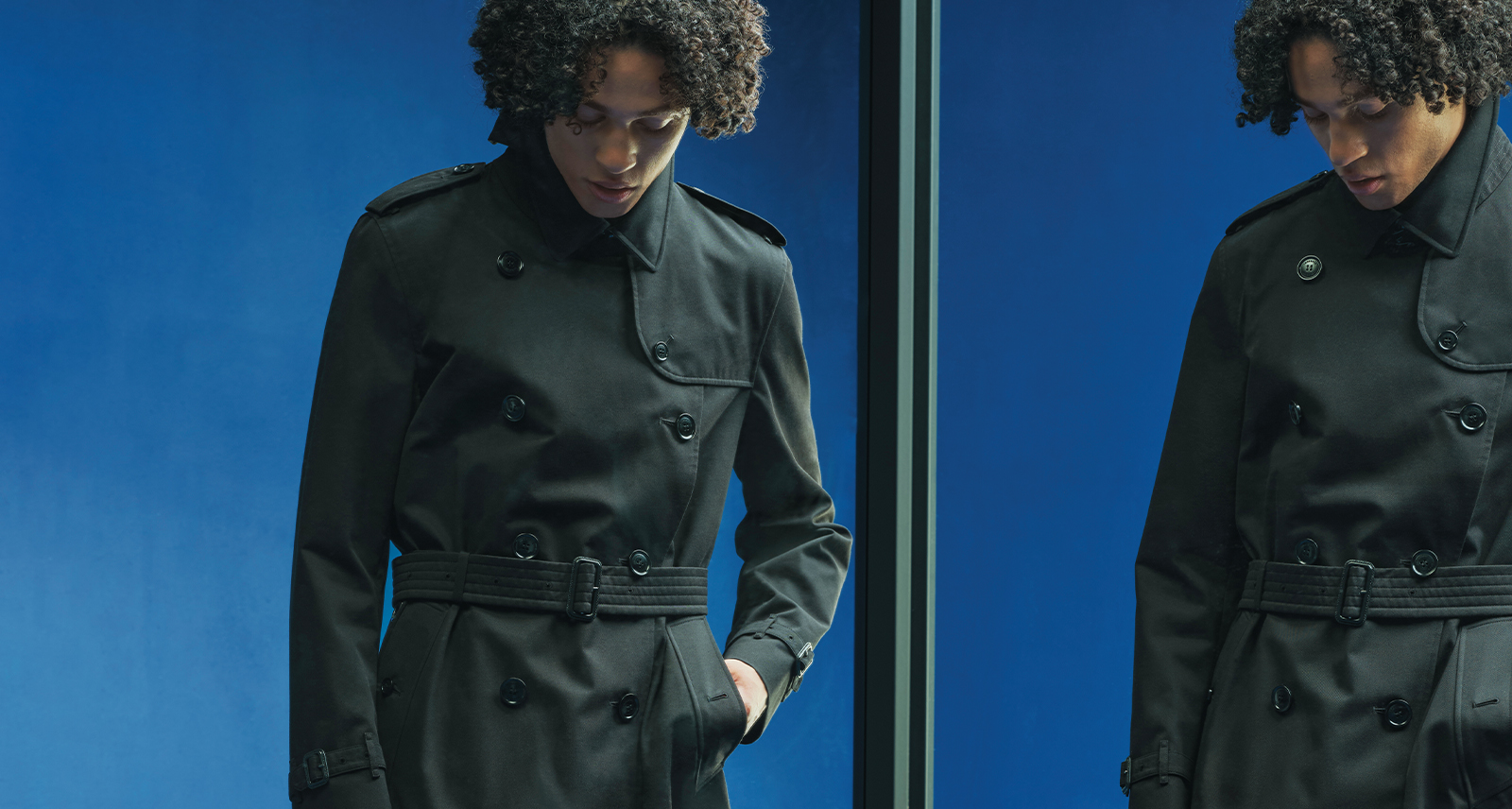 Model wearing black Burberry trench coat next to a mirror image with a blue background
