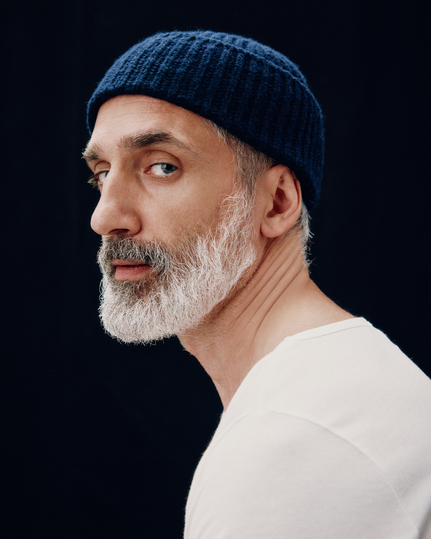 Book for Men Fall Winter fashion photoshoot headshot with blue beanie