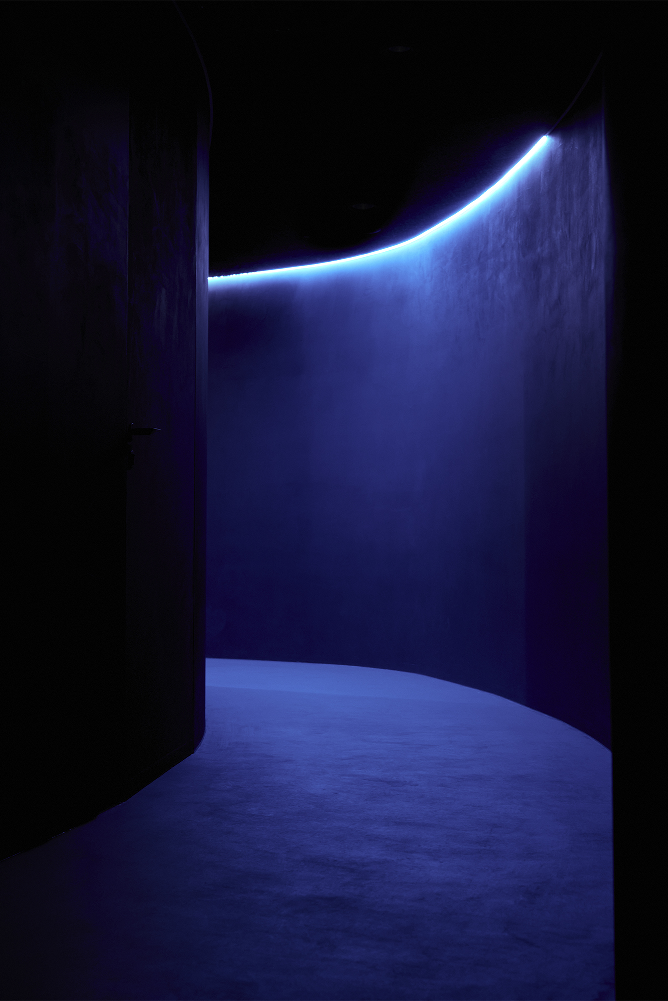 blue backlit hallway inside iris restaurant