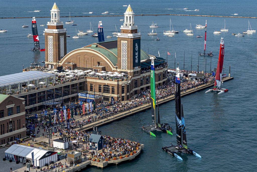 aerial view of two sailboats in harbour for rolex x sailgp